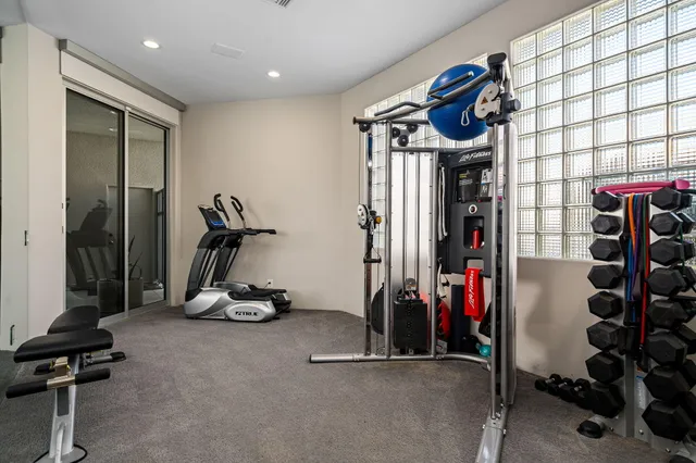 a bathroom with a glass shower door and a mirror