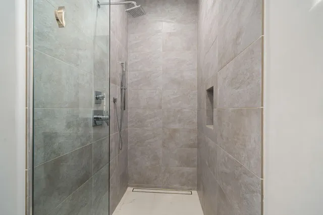 a view of a patio with couches table and chairs potted plants and palm tree