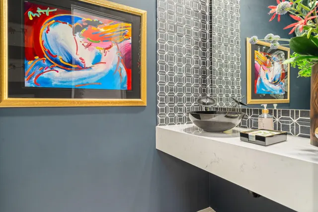 a view of a pathway of a house with wooden fence