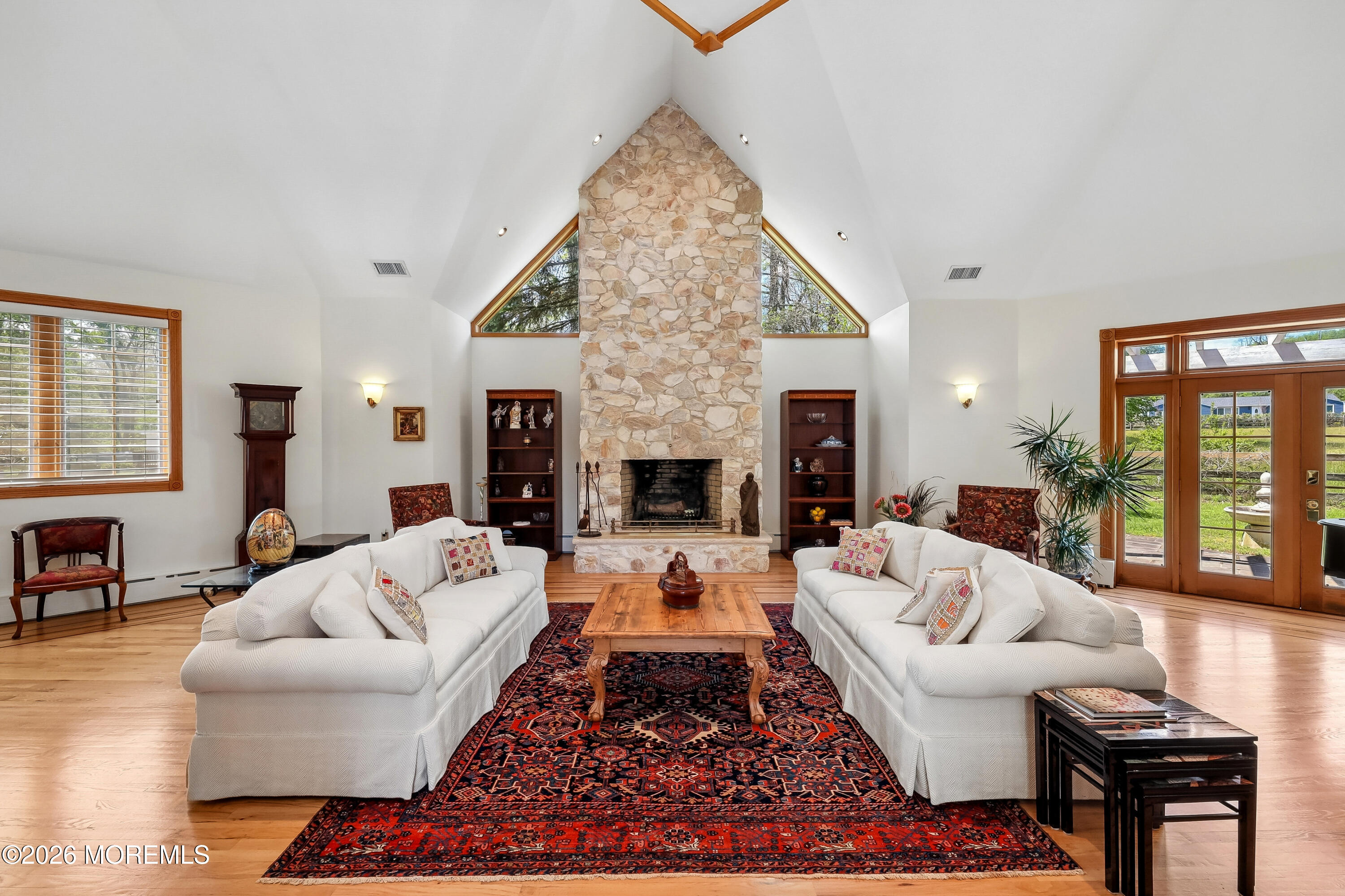 187 Hockhockson Road Colts Neck, NJ 07722 - Photo 9 of 55 a living room with furniture or couch and a fireplace