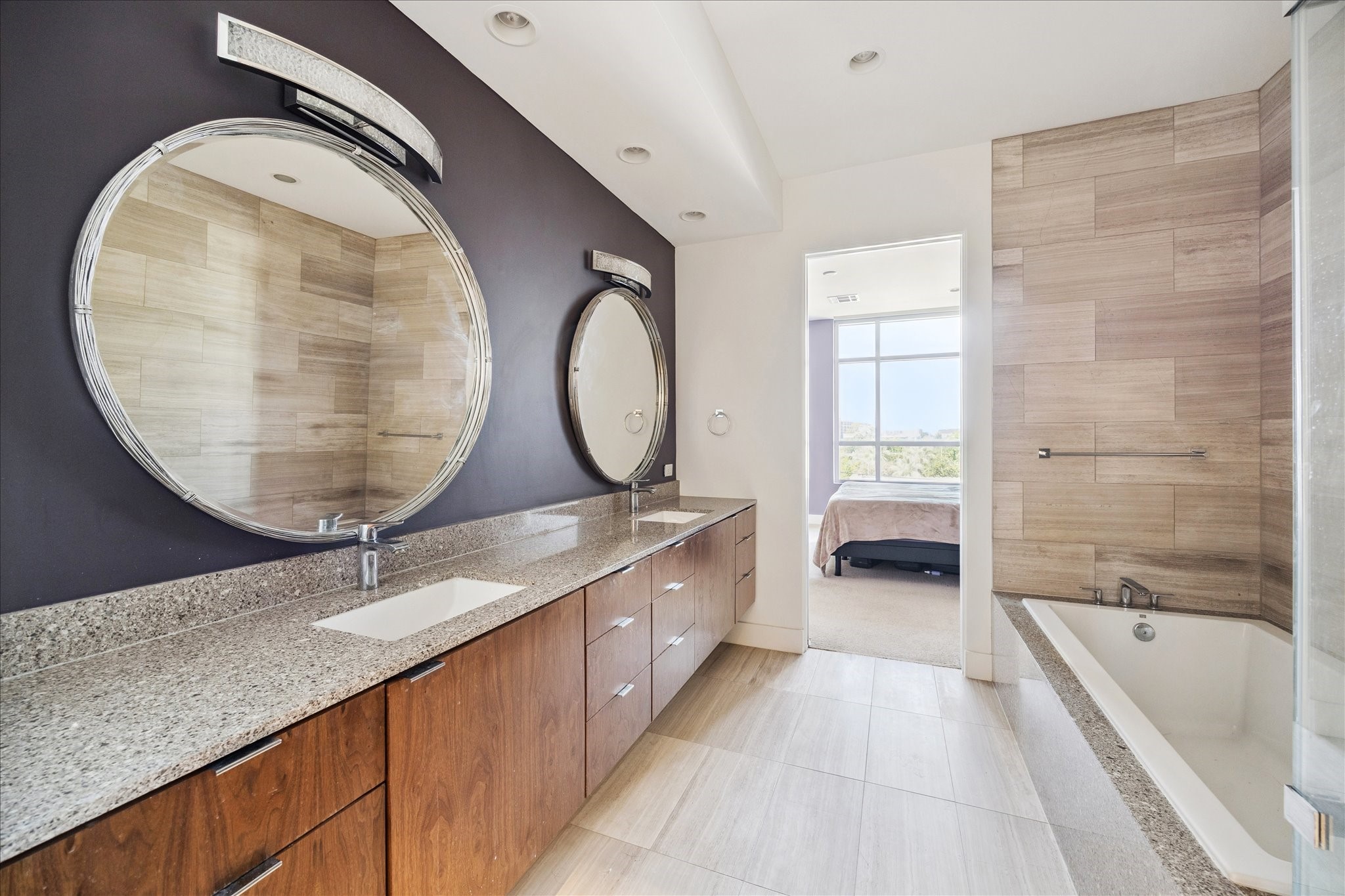 3331 D'Amico Street, Unit 404 Houston, TX 77019 - Photo 13 of 22 a bathroom with a granite countertop sink and a mirror