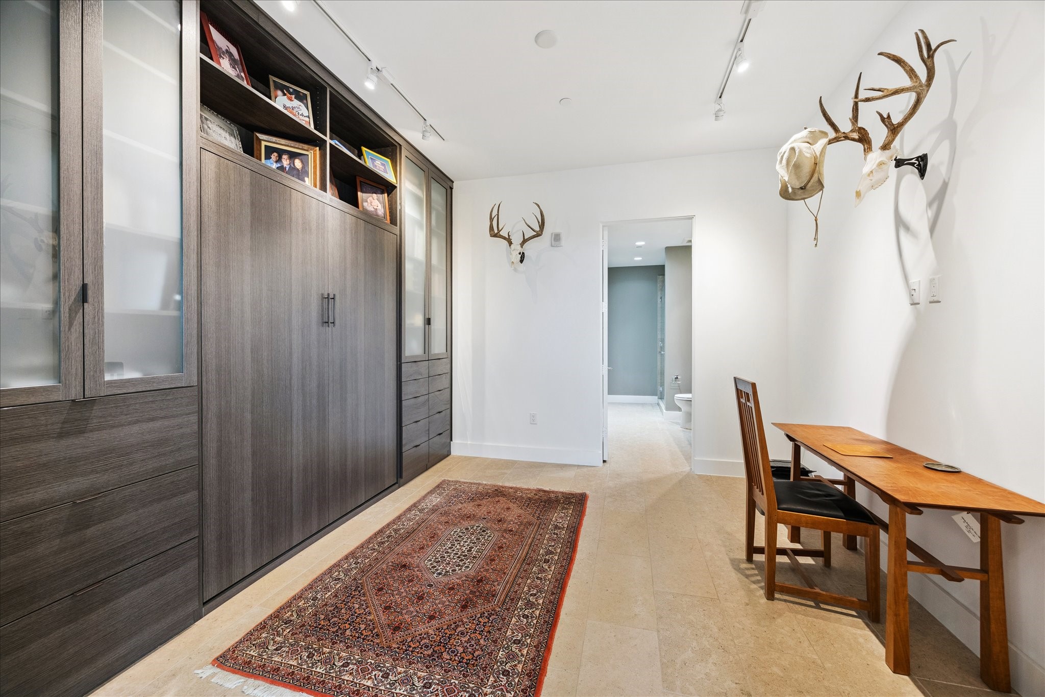 3331 D'Amico Street, Unit 404 Houston, TX 77019 - Photo 16 of 22 a view of a hallway and wooden floor