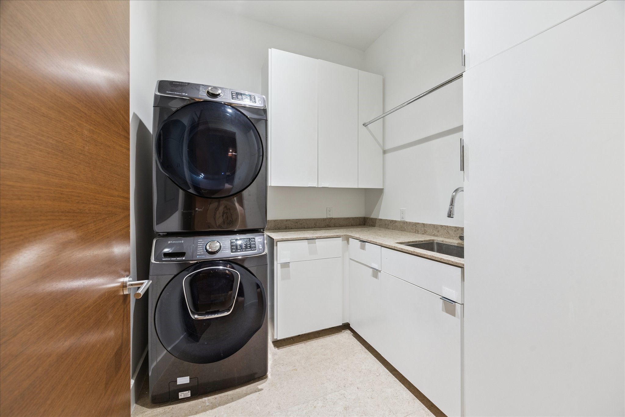 3331 D'Amico Street, Unit 404 Houston, TX 77019 - Photo 18 of 22 a utility room with sink dryer and washer