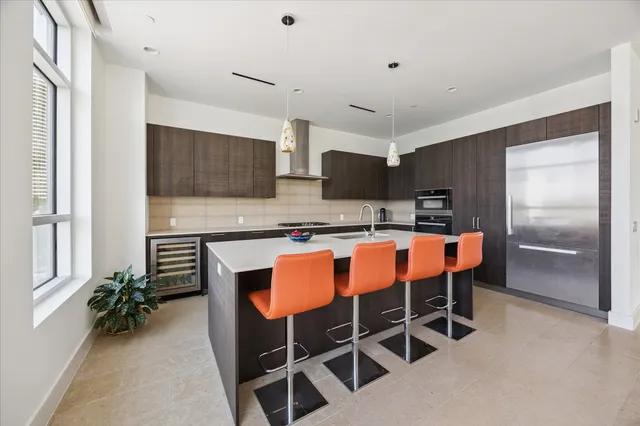 a view of a kitchen and dining room