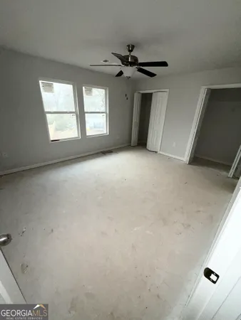 an empty room with staircase