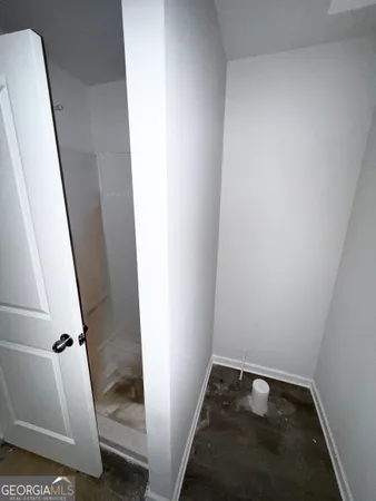 a bathroom with a tub and a shower