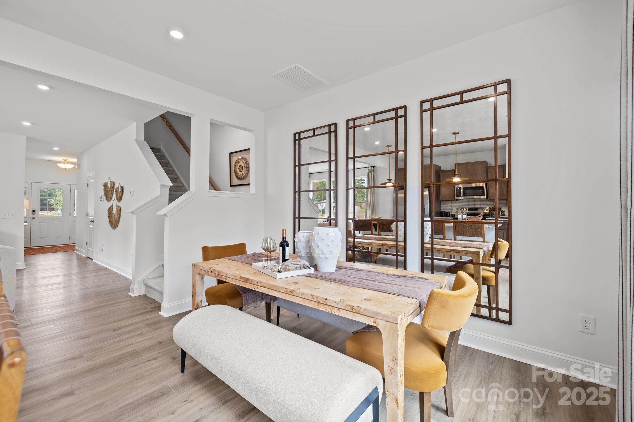 7708 Ethora Way Charlotte, NC 28216 - Photo 37 of 44 a dining room with furniture and wooden floor