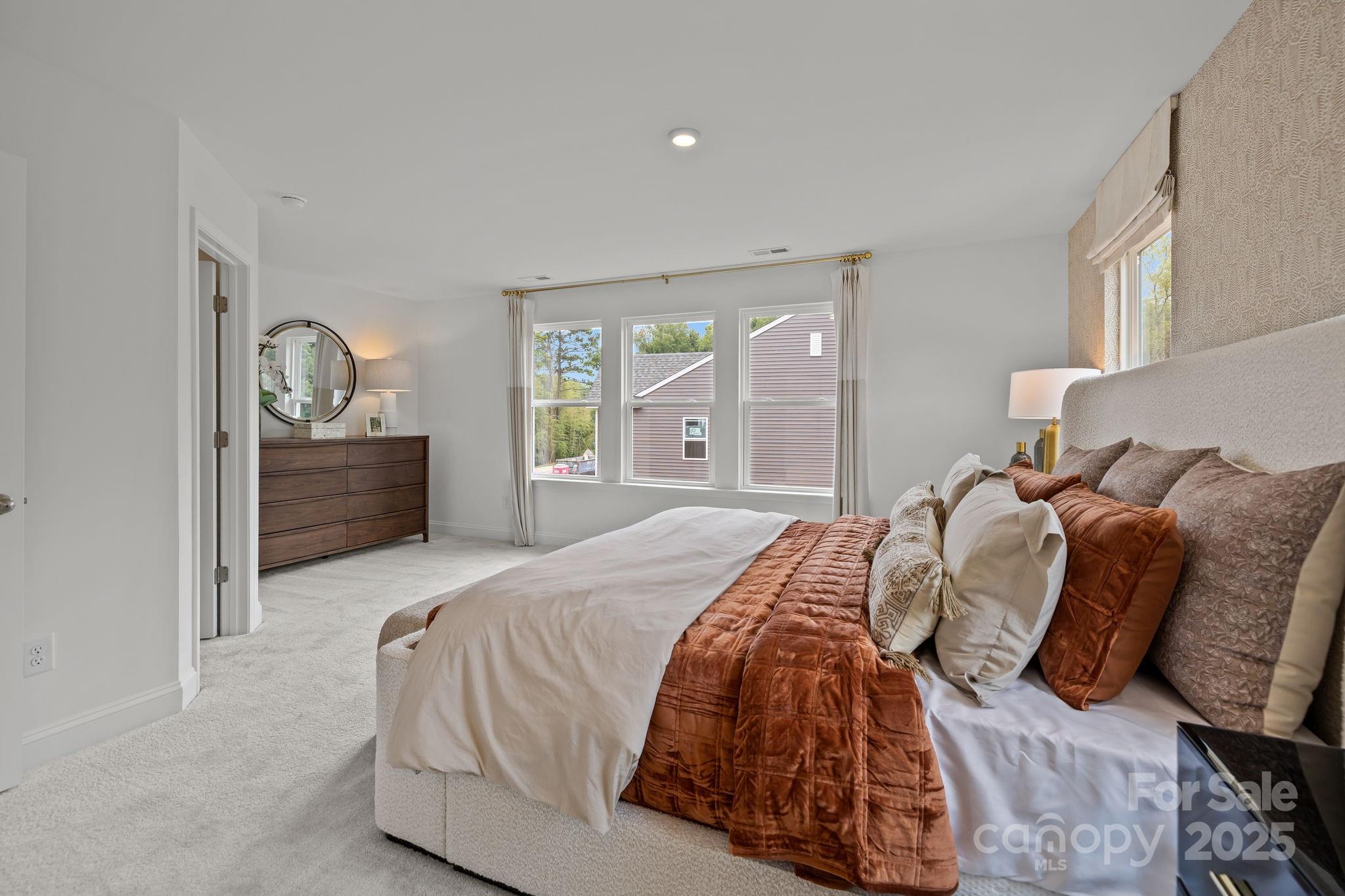 7708 Ethora Way Charlotte, NC 28216 - Photo 41 of 44 a bedroom with a bed and window