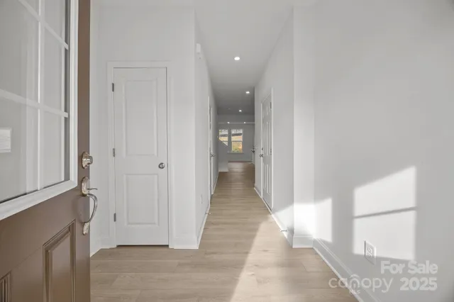 a kitchen with stainless steel appliances kitchen island granite countertop a stove a sink a dining table and chairs