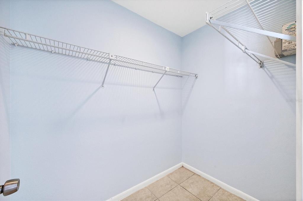 1531 Placida Road, Unit 202 Englewood, FL 34223 - Photo 22 of 44 a view of a room with racks on the wall