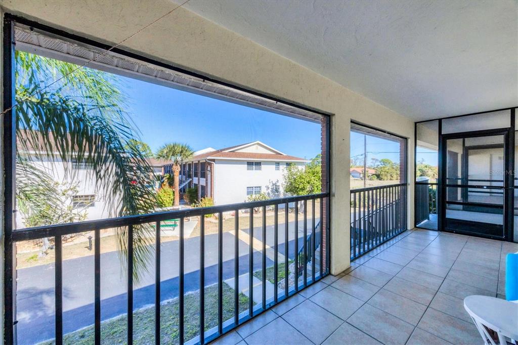 1531 Placida Road, Unit 202 Englewood, FL 34223 - Photo 3 of 44 a view of hallway with balcony
