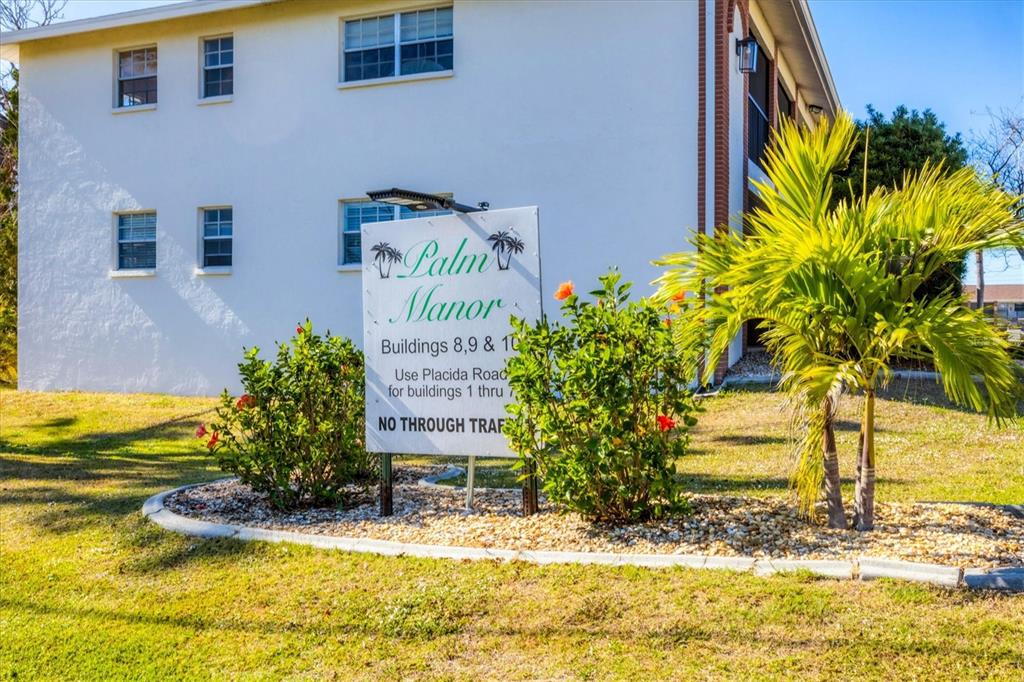 1531 Placida Road, Unit 202 Englewood, FL 34223 - Photo 42 of 44 a sign on the side of a building