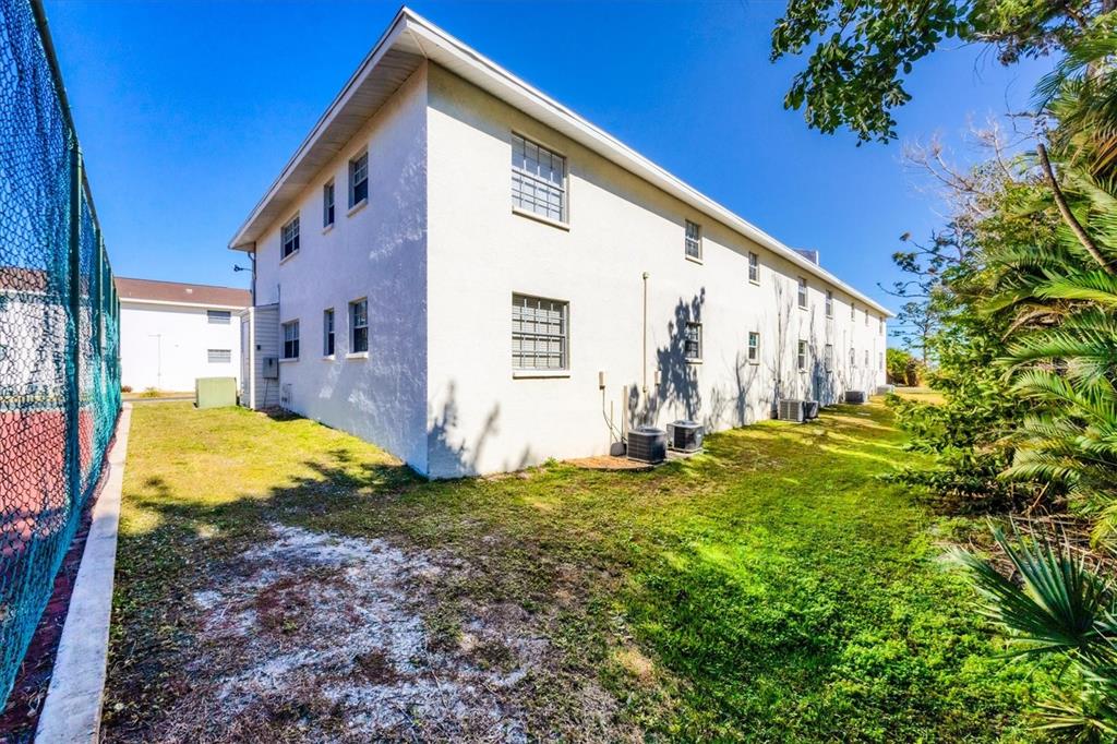 1531 Placida Road, Unit 202 Englewood, FL 34223 - Photo 44 of 44 a view of a house with backyard and sitting area