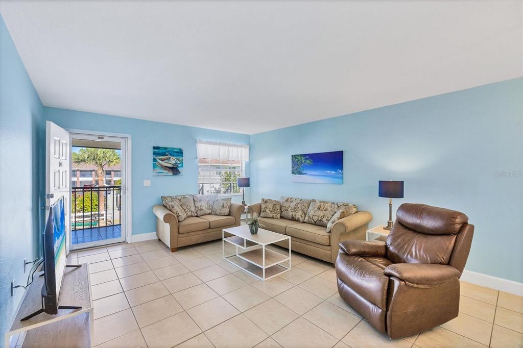 1531 Placida Road, Unit 202 Englewood, FL 34223 - Photo 6 of 44 a living room with furniture and a window