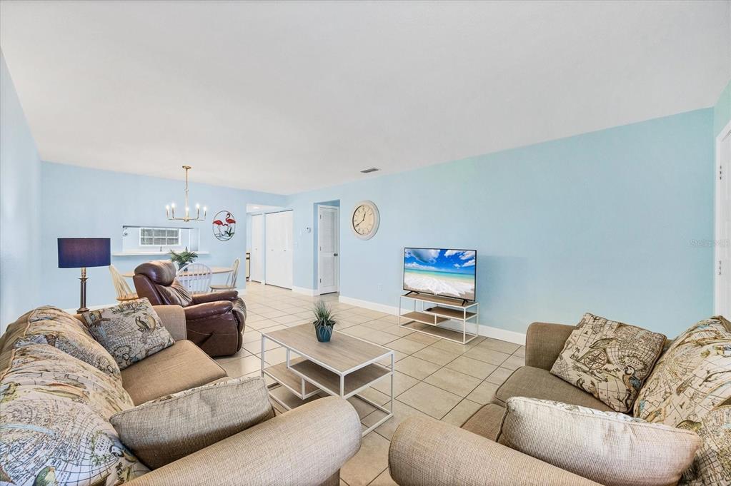 1531 Placida Road, Unit 202 Englewood, FL 34223 - Photo 9 of 44 a living room with furniture a fireplace and a couch