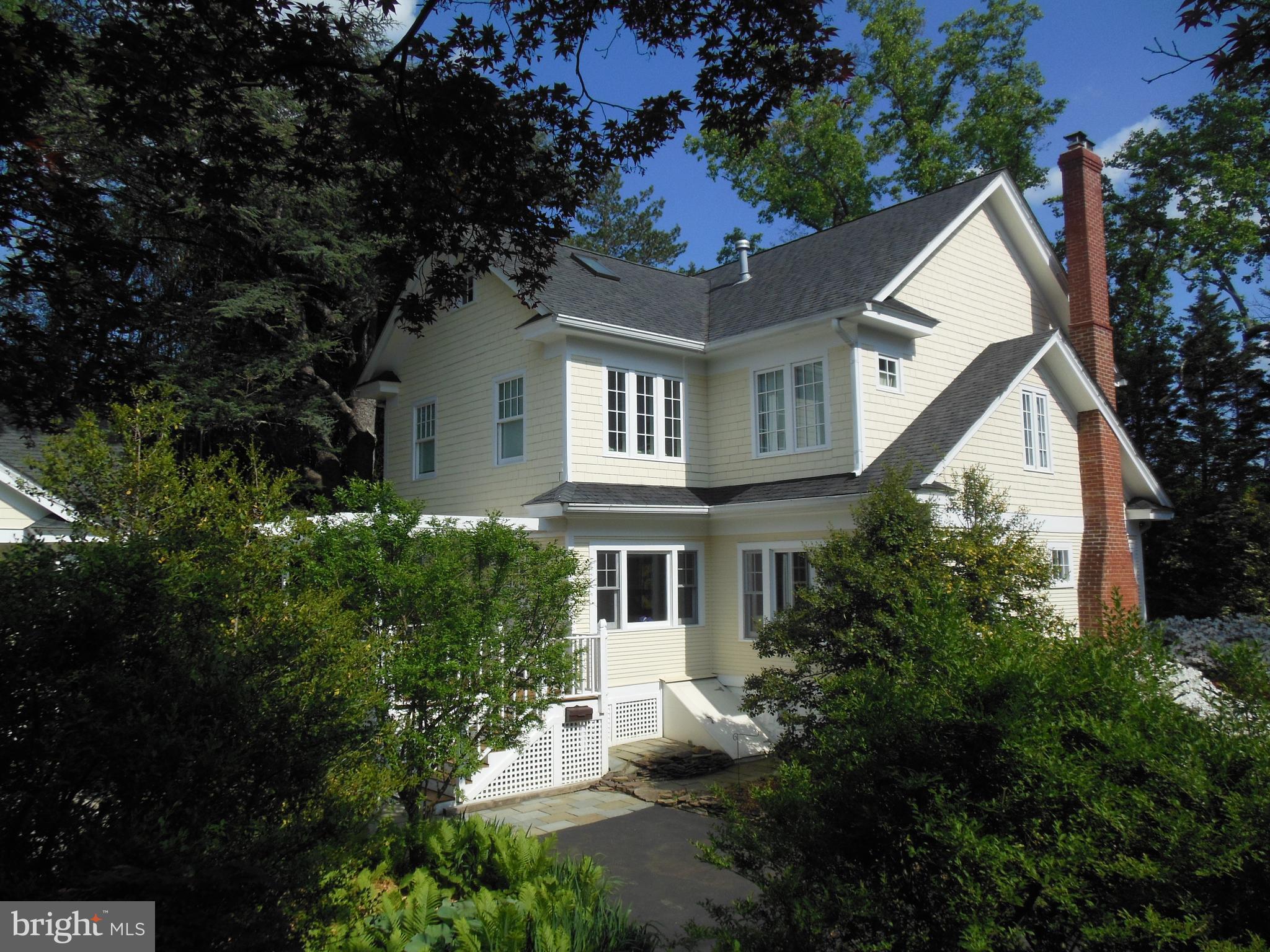 1213 Buchanan Street McLean, VA 22101 - Photo 2 of 30 a front view of a house with a yard and trees