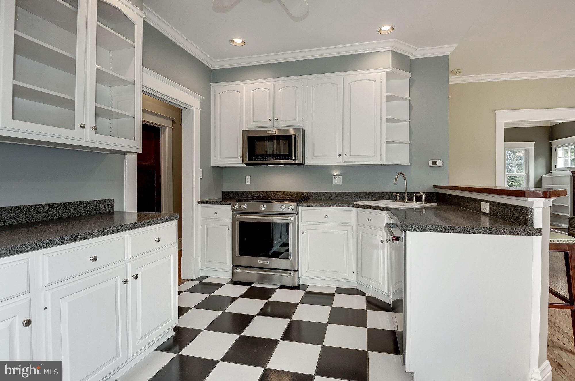 1213 Buchanan Street McLean, VA 22101 - Photo 11 of 30 a kitchen with a sink a stove and cabinets