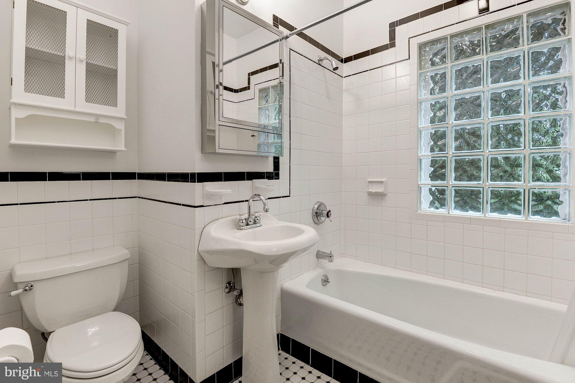 1213 Buchanan Street McLean, VA 22101 - Photo 14 of 30 a bathroom with a sink a toilet and shower
