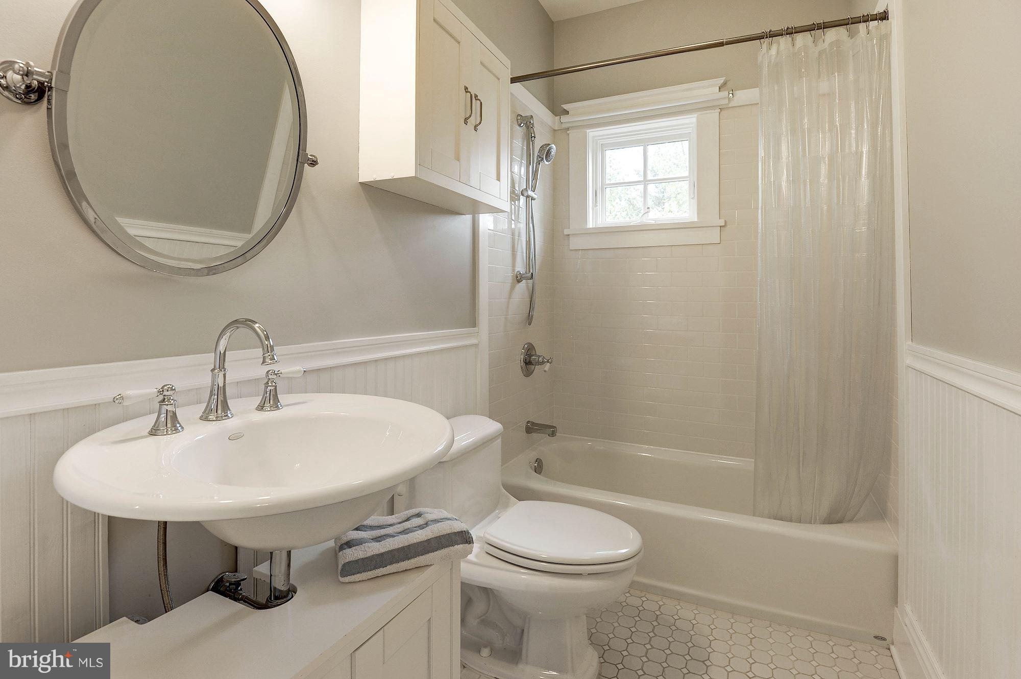1213 Buchanan Street McLean, VA 22101 - Photo 22 of 30 a bathroom with a sink a toilet and a mirror
