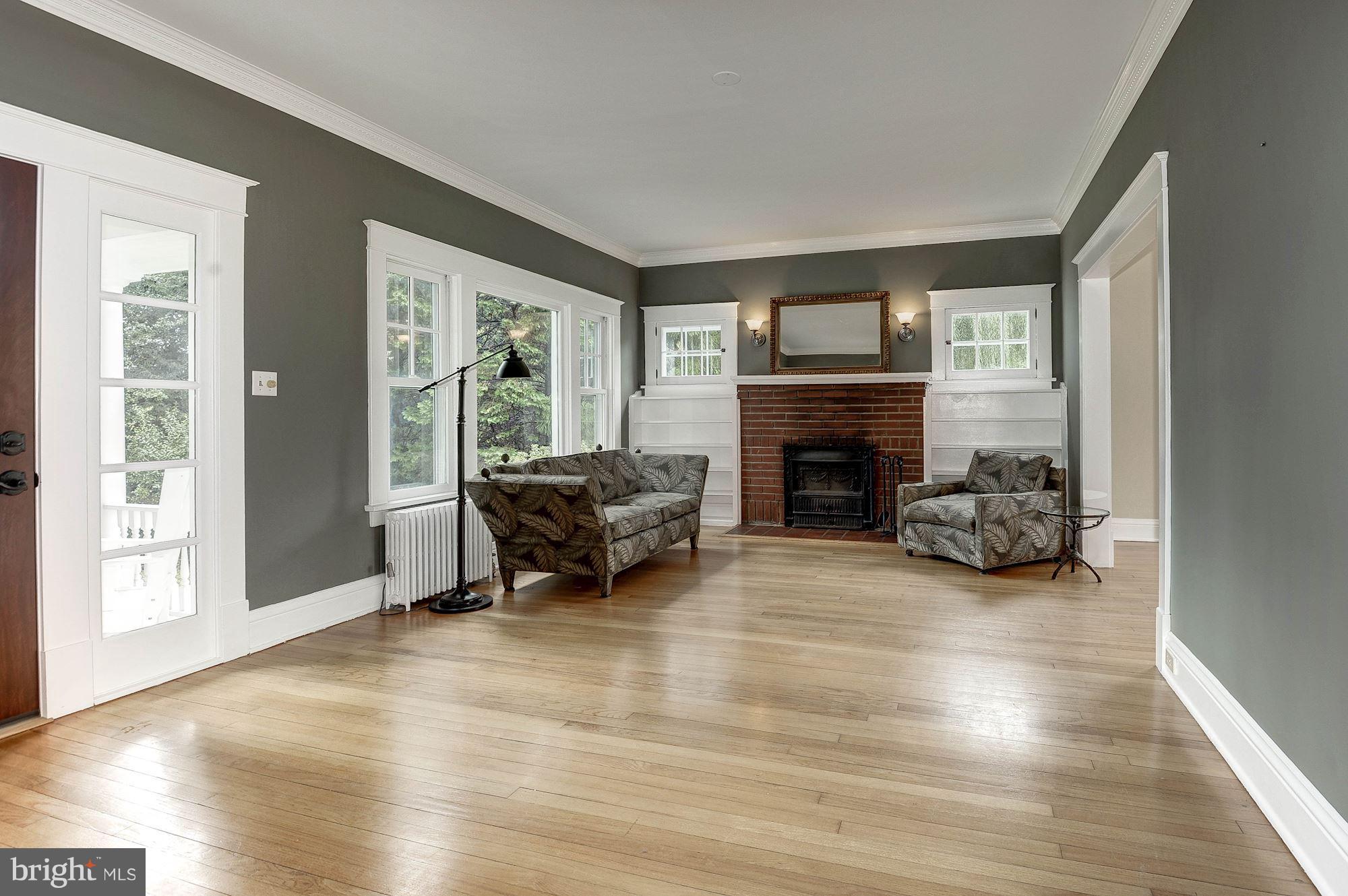 1213 Buchanan Street McLean, VA 22101 - Photo 5 of 30 a living room with furniture and a fireplace