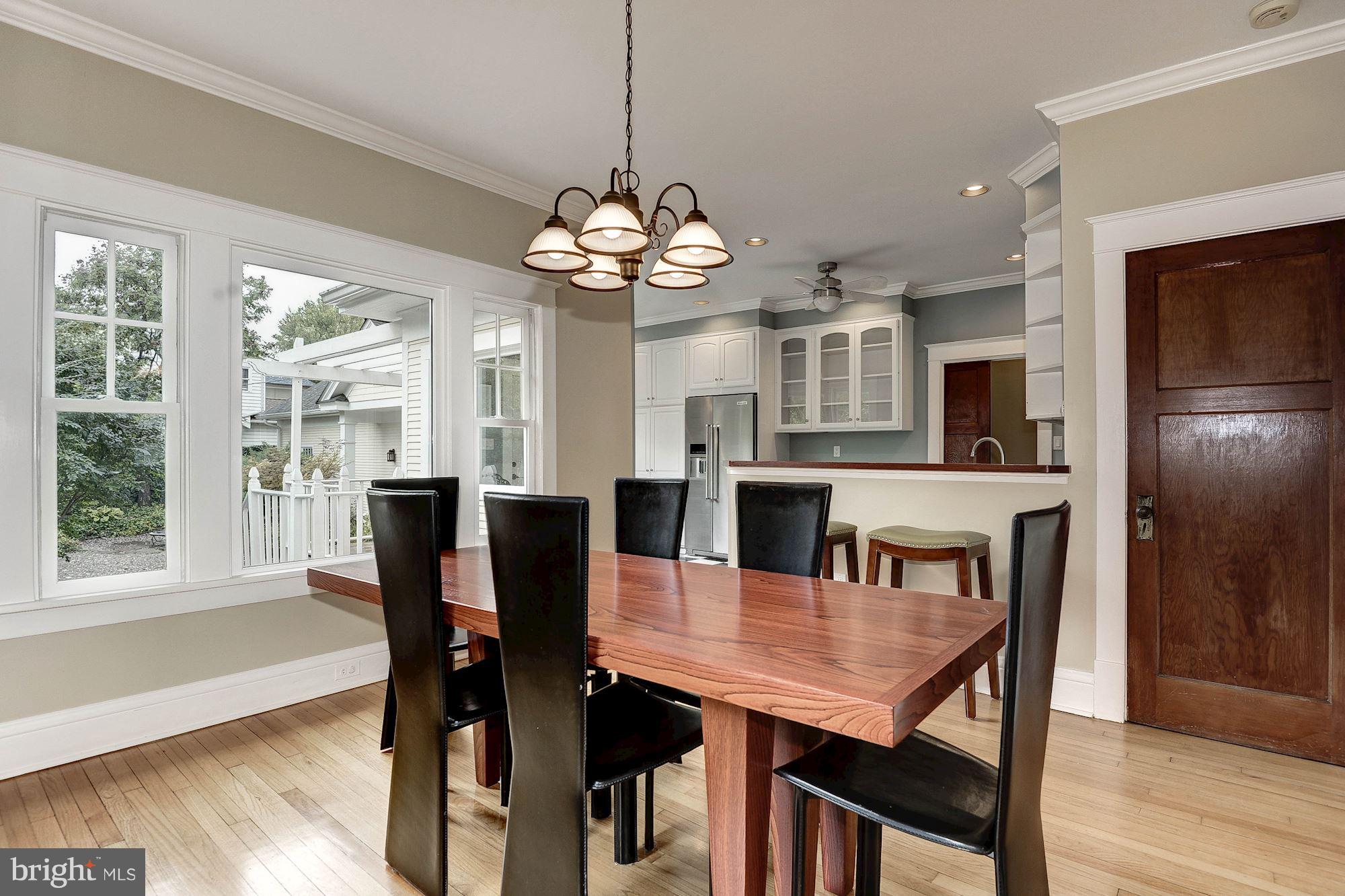 1213 Buchanan Street McLean, VA 22101 - Photo 7 of 30 a view of a dining room with furniture window and wooden floor