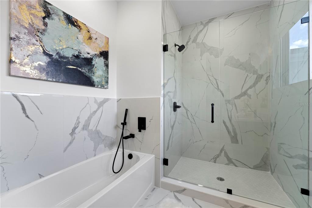 6299 Chorus Drive Mascotte, FL 34753 - Photo 19 of 24 a bathroom with a shower