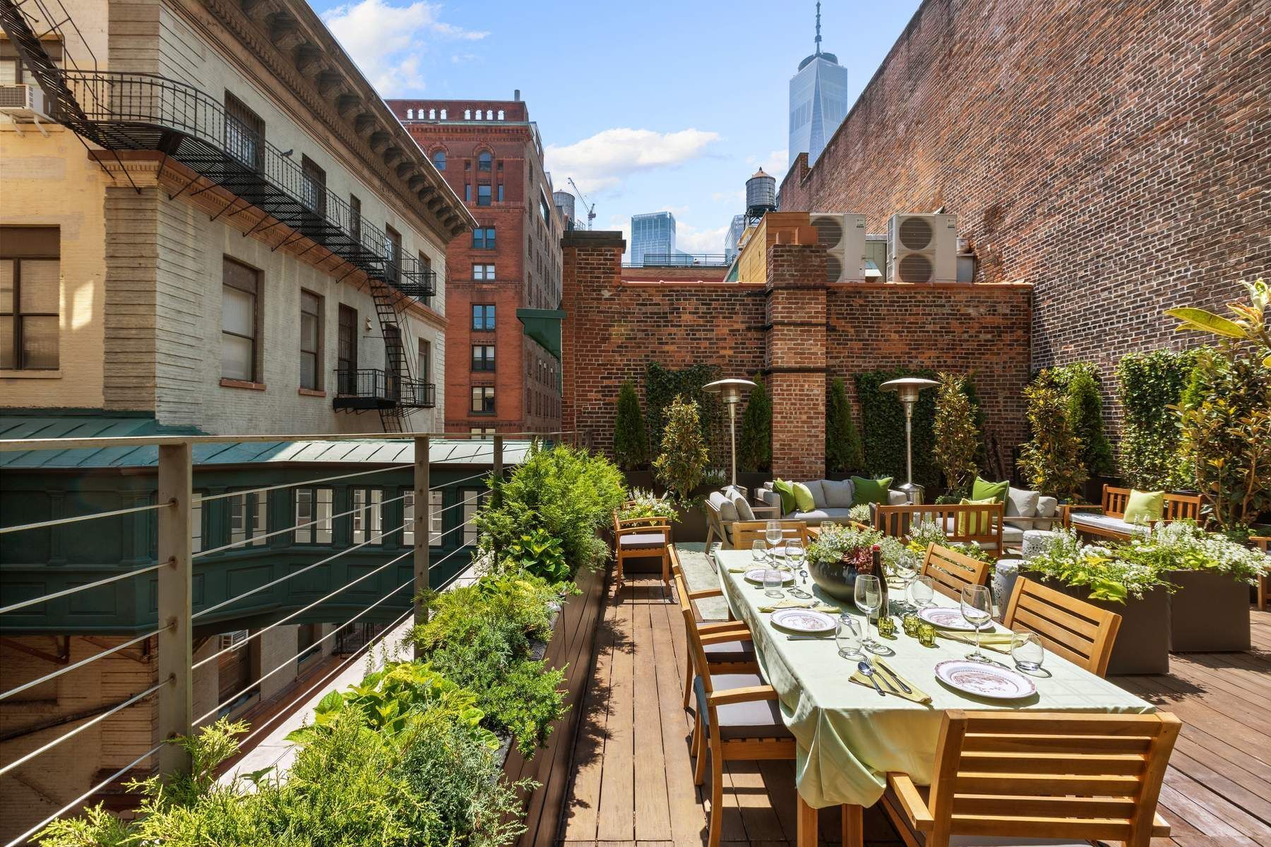4 Staple Street Manhattan, NY 10013 - Photo 19 of 29 a view of a patio with table and chairs and potted plants