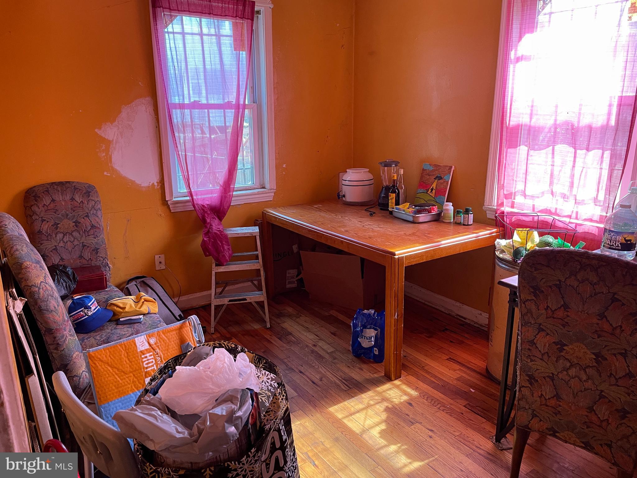 1658 F Street Northeast Washington, DC 20002 - Photo 3 of 9 a room with furniture and a window
