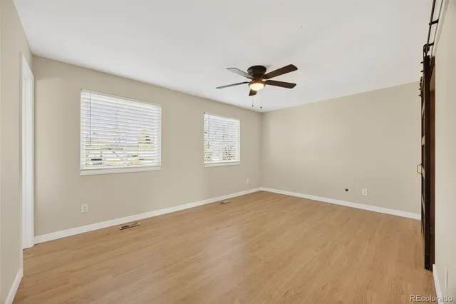 a view of an empty room with a window