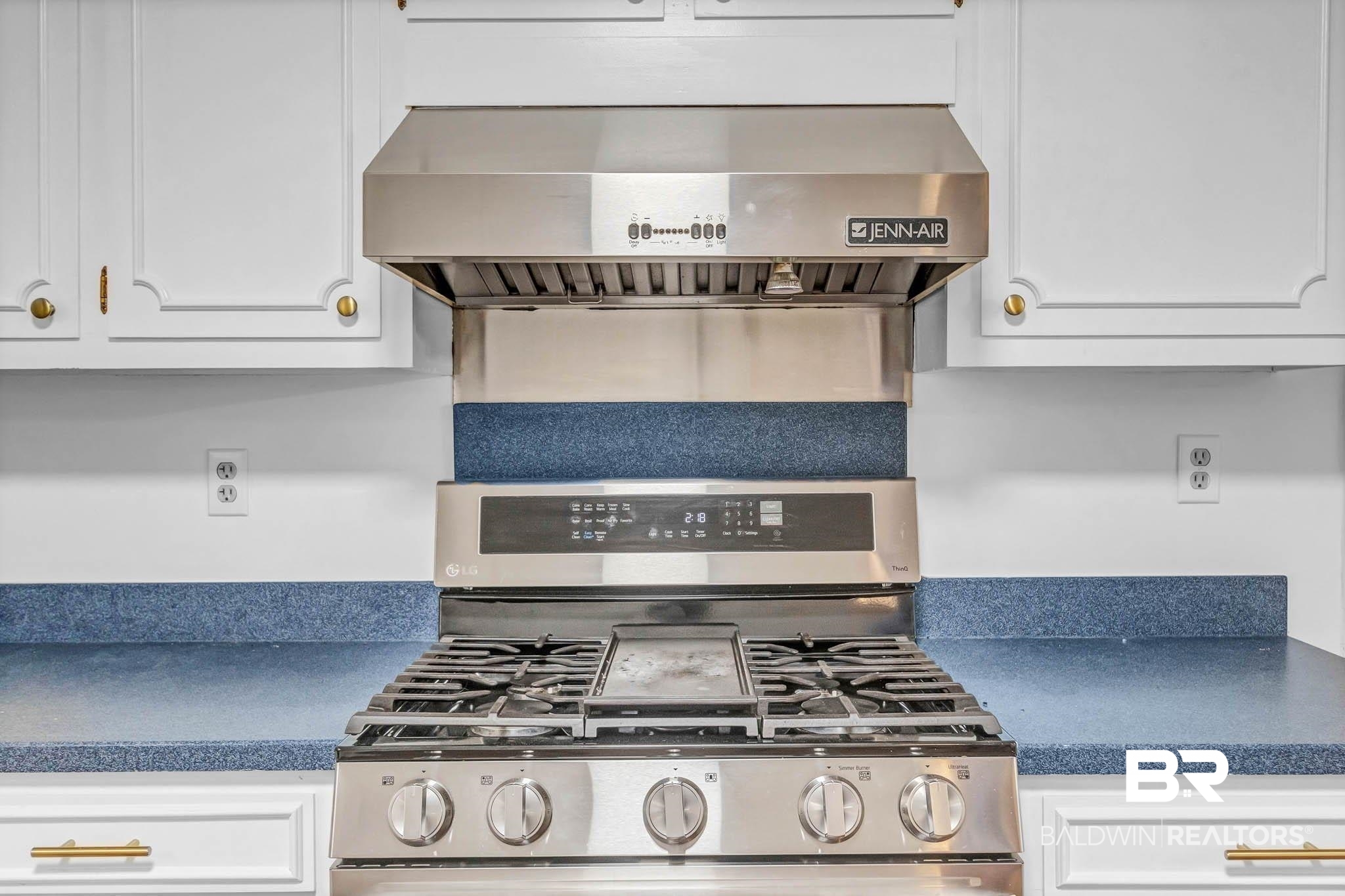 309 West Brandy Run Road Mobile, AL 36608 - Photo 22 of 100 Kitchen with extractor fan, gas range, white cabinetry, and dark countertops