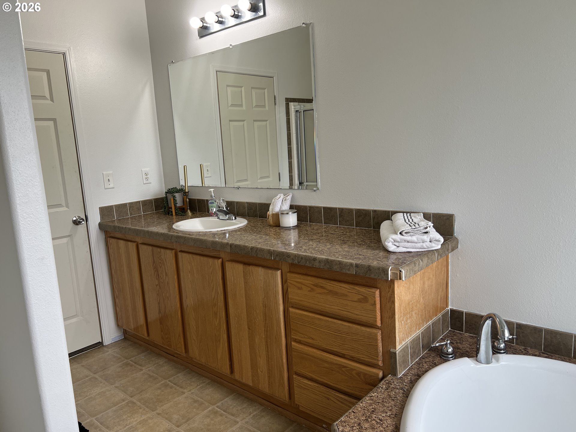 210 Northwest Grinstead Street Siletz, OR 97380 - Photo 18 of 29 a bathroom with a sink and a mirror