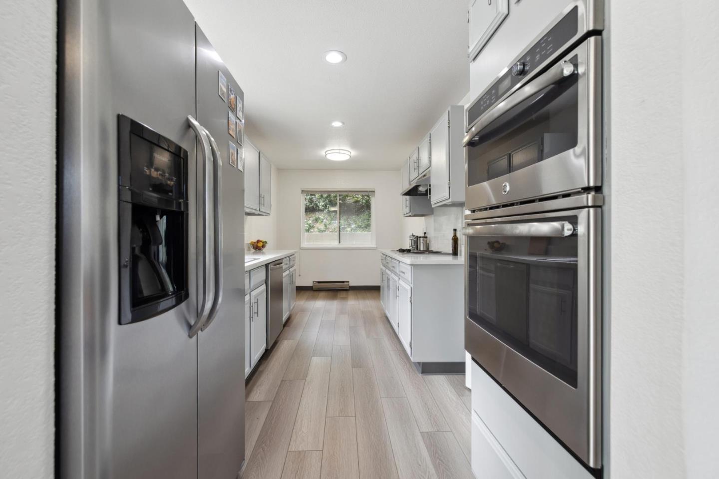 46 Shepherds Knoll Road Pebble Beach, CA 93953 - Photo 12 of 41 a kitchen with stainless steel appliances granite countertop a refrigerator and a stove