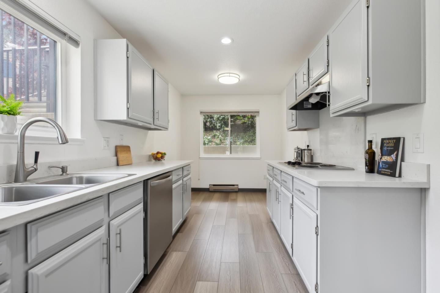 46 Shepherds Knoll Road Pebble Beach, CA 93953 - Photo 14 of 41 a kitchen with kitchen island granite countertop a sink a counter space appliances and cabinets