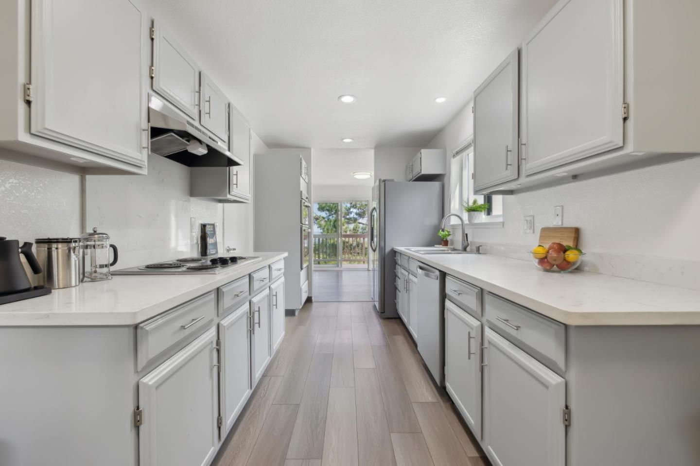 46 Shepherds Knoll Road Pebble Beach, CA 93953 - Photo 16 of 41 a kitchen with kitchen island granite countertop a sink a counter space stainless steel appliances and cabinets