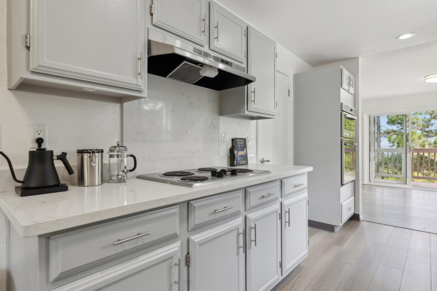46 Shepherds Knoll Road Pebble Beach, CA 93953 - Photo 17 of 41 a kitchen with stainless steel appliances granite countertop a sink a stove and a refrigerator