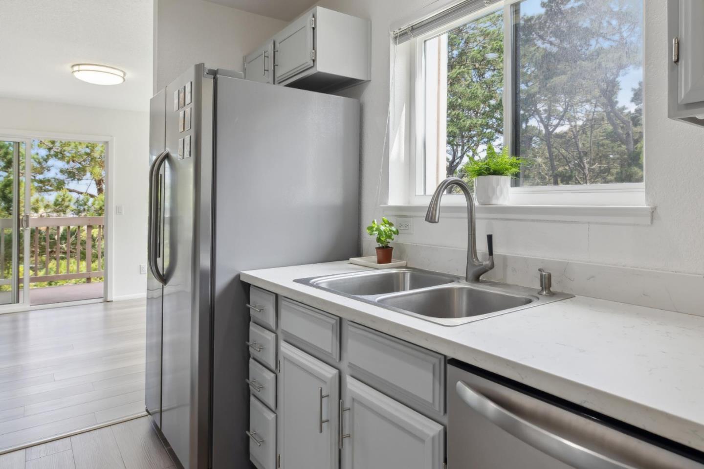 46 Shepherds Knoll Road Pebble Beach, CA 93953 - Photo 18 of 41 a kitchen with a refrigerator and a sink