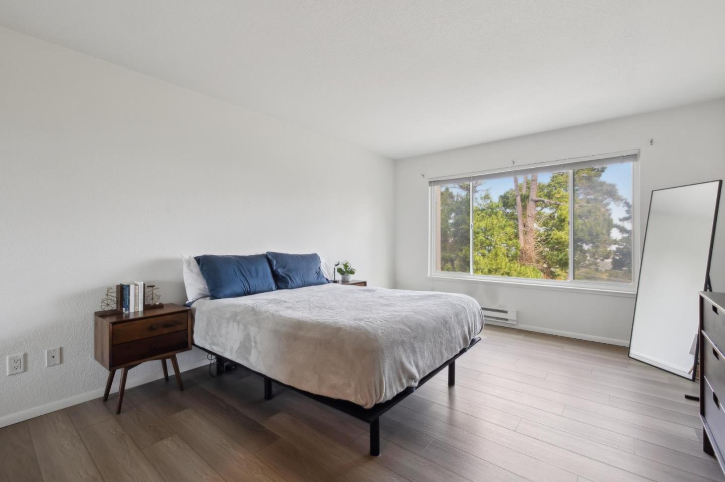 46 Shepherds Knoll Road Pebble Beach, CA 93953 - Photo 20 of 41 a bed sitting in a bedroom next to a window