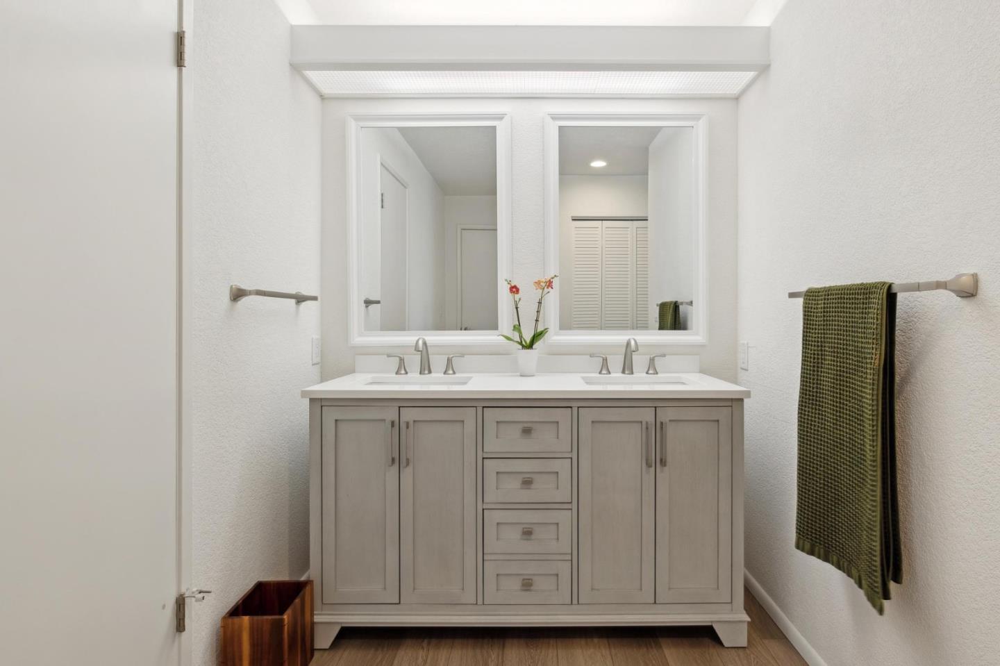 46 Shepherds Knoll Road Pebble Beach, CA 93953 - Photo 23 of 41 a bathroom with a granite countertop sink and a mirror