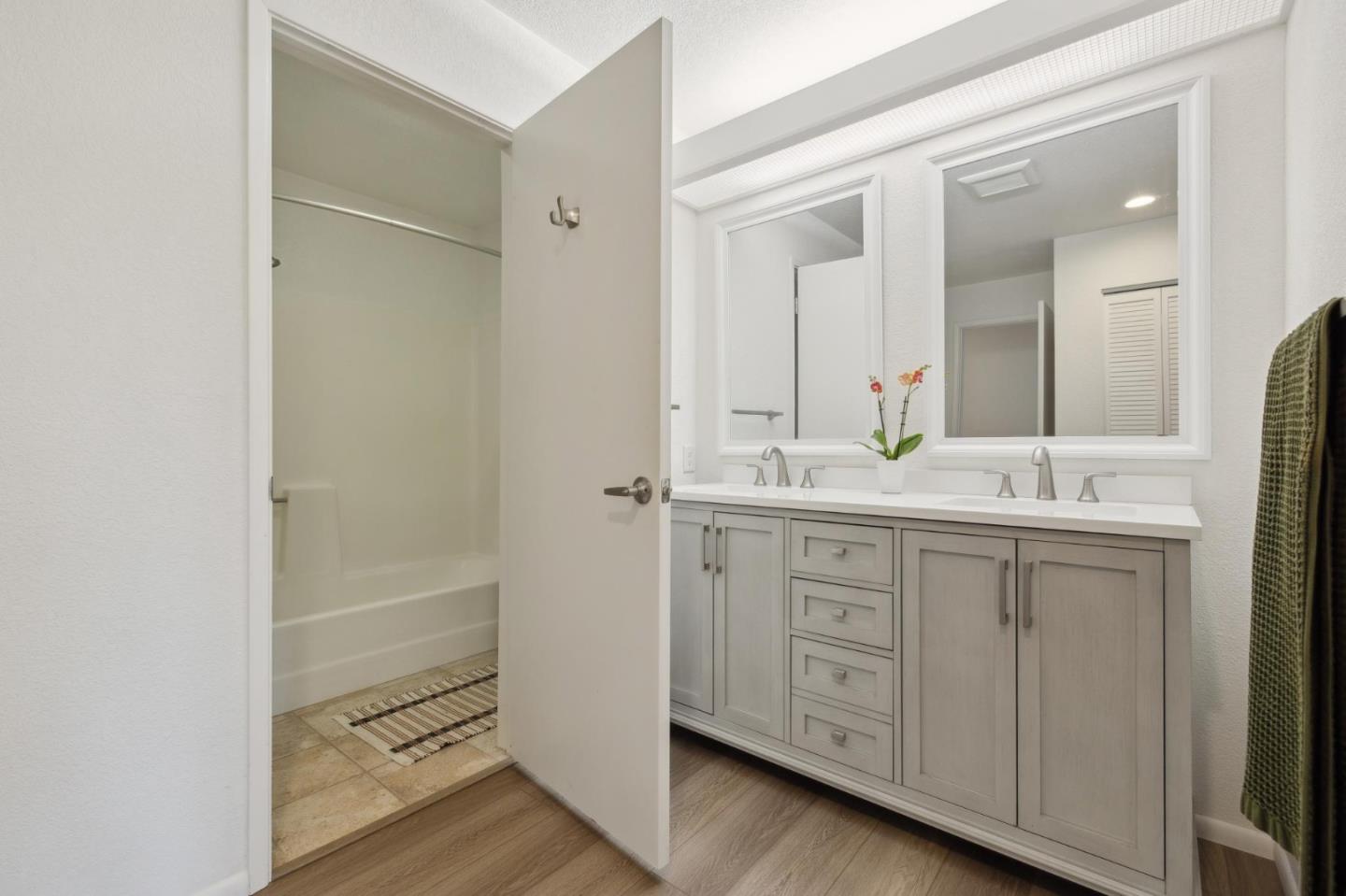 46 Shepherds Knoll Road Pebble Beach, CA 93953 - Photo 24 of 41 a bathroom with a double vanity sink and mirror