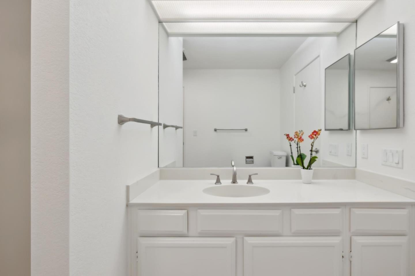 46 Shepherds Knoll Road Pebble Beach, CA 93953 - Photo 30 of 41 a bathroom with a sink and a mirror