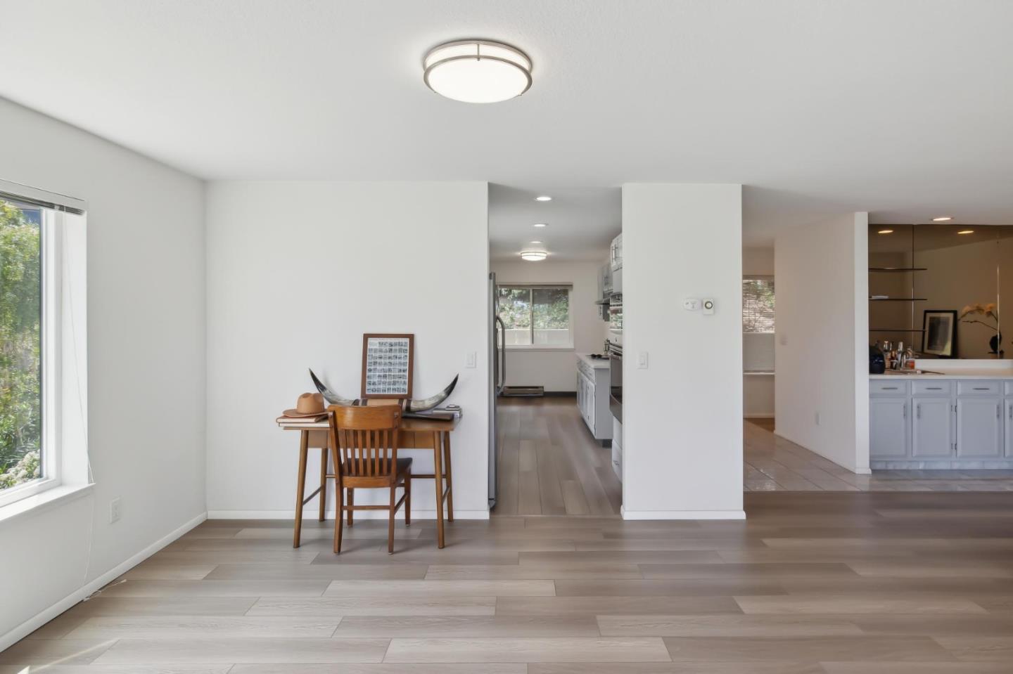 46 Shepherds Knoll Road Pebble Beach, CA 93953 - Photo 7 of 41 a view of a dining room with furniture and wooden floor