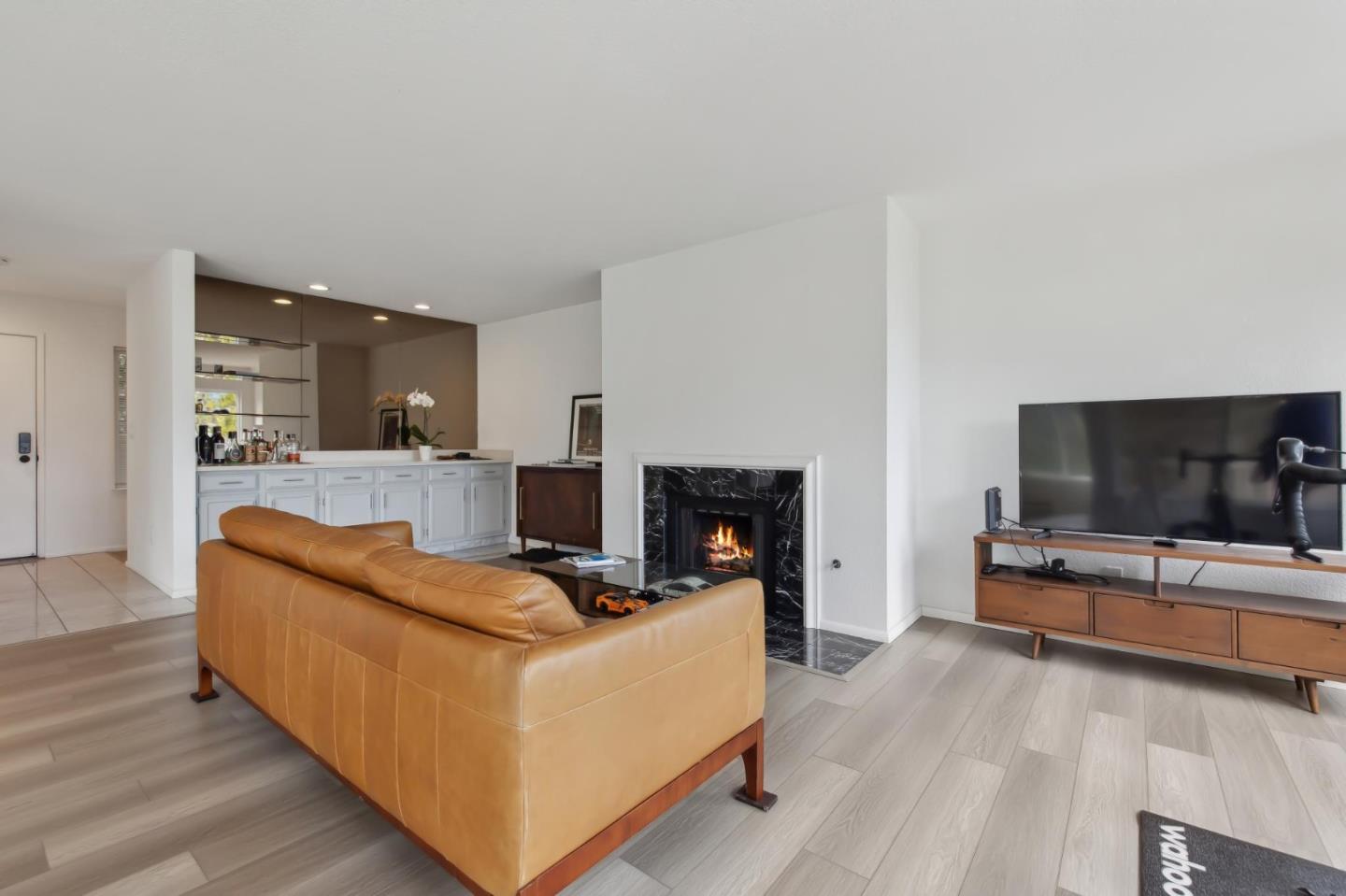 46 Shepherds Knoll Road Pebble Beach, CA 93953 - Photo 8 of 41 a living room with furniture and a flat screen tv