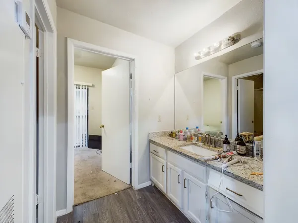 a bathroom with a double vanity sink and mirror