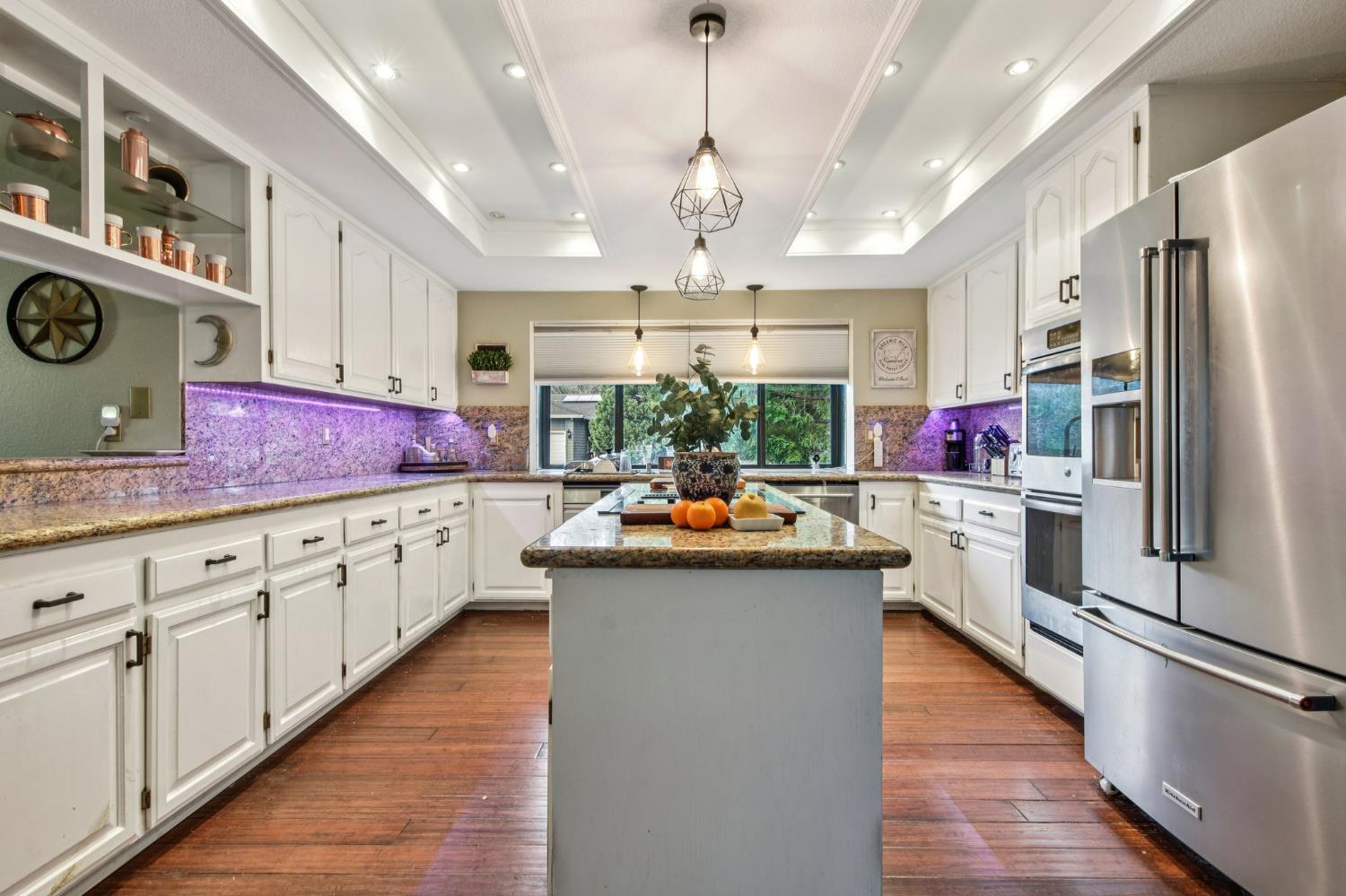 3571 Sudbury Road Cameron Park, CA 95682 - Photo 5 of 87 Kitchen Lights are NOT Purple. Its a refection. Area is bright and warming