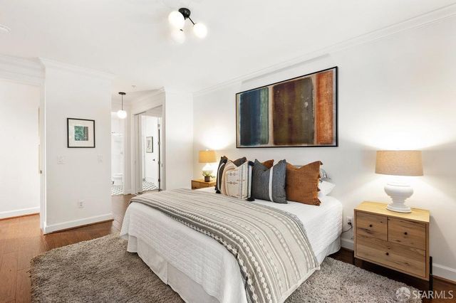 a bedroom with bed and window