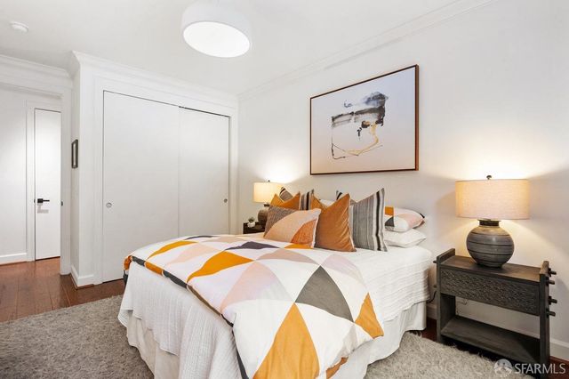 a bedroom with bed and window