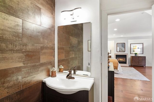 a bathroom with a sink and a mirror