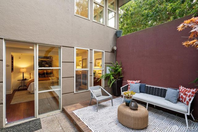 a outdoor living space with furniture and a potted plant