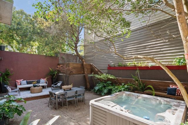 a view of backyard with swimming pool and outdoor seating