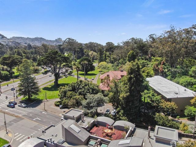an aerial view of a house with a garden